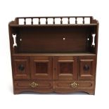 AN EDWARDIAN WALNUT HANGING CABINET with bobbin turned gallery and pierced sides, fitted with two