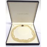 A THREE ROW CULTURED PEARL NECKLACE the 71/75/79 pearls of approximately 5-6.2mm diameter, to a