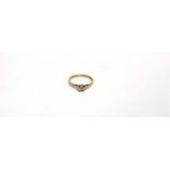 A 9 CARAT GOLD SINGLE STONE DIAMOND RING the brilliant cut of approximately 0.1 carat; with a pair