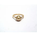 A SINGLE STONE CULTURED PEARL RING the unmarked mount finger size M, 2.8g gross