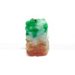 A THREE COLOUR CARVED JADE PENDANT from green to brown with pale colourless areas, 4.9cm long, 23g