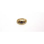 AN EDWARDIAN FIVE STONE SAPPHIRE AND DIAMOND RING Birmingham 1906, finger size P, 3.8g gross