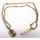 A 9 CARAT GOLD CHAIN with a Saint Christopher and propelling pencil attached, 19g gross