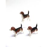 A BESWICK FIGURE OF A BEAGLE 'CH. Wendover Billy' (no 1939) 8.5cm high (tail) and two others similar