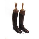 A PAIR OF BROWN LEATHER FIELD BOOTS complete with trees