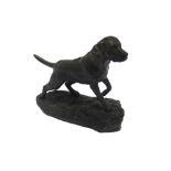 A FIGURE OF A STANDING LABRADOR by Heridities, 15cm long