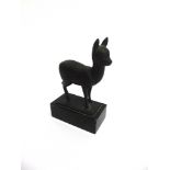 A BRONZE FIGURE OF A STANDING FAWN signed F. Koelle, and raised on a rectangular black marble