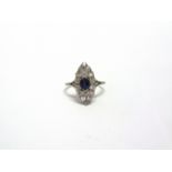 A SAPPHIRE AND DIAMOND MARQUISE CLUSTER RING stamped 'Platinum', the oval cut sapphire measuring