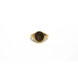 AN 18 CARAT GOLD CRESTED SIGNET RING Birmingham 1941, finger size S, 7.6g gross