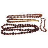 A SMALL AMBER BEAD NECKLACE with three other amber coloured necklaces