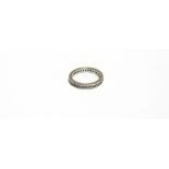 A DIAMOND FULL ETERNITY RING in unmarked white gold, the thirty five O channel set brilliant cuts