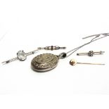 TWO STONE SET BAR BROOCHES a stickpin; a single stone bar brooch; and a late Victorian silver locket