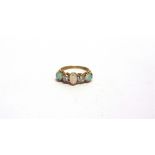 AN OPAL AND DIAMOND FIVE STONE RING the yellow mount unmarked, the three graduated cabochon with