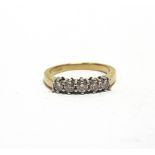 AN 18 CARAT GOLD FIVE STONE DIAMOND HALF HOOP RING the brilliant cuts totalling approximately 0.5