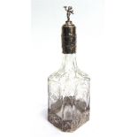 A SILVER MOUNTED DECANTER BOTTLE with import marks for 1924 and pseudo marks, mounted to the base