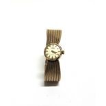 TREBEX, A LADY'S 9 CARAT GOLD MECHANICAL BRACELET WATCH 1960, the circular white dial with gilt