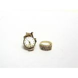 A DRESS RING SET WITH CUBIC ZIRCONIA stamped '750', 5.4g gross; and a lady's 9 carat gold Sekonda