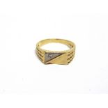 A GENTLEMAN'S DIAMOND SET SIGNET RING stamped '750', the two colour rectangular head set with a