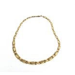A 9 CARAT GOLD COLLAR of graduated fancy hollow panel and kiss links, 45cm long, 13.5g, cased