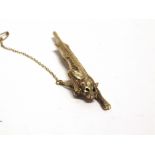 A 'BIG CAT' BROOCH unmarked, in a stalking pose, diamond cut decoration, 6.2cm long, 6g gross