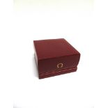 AN OMEGA WATCH BOX red, gilt logo and linear decoration