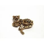 A 9 CARAT SAPPHIRE RUBY AND DIAMOND 'BIG CAT' BROOCH the recumbant Leopard with sapphire spots, ruby