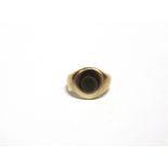 A SIGNET RING with worn gold marks, tests as 9 carat gold, 7.6g gross