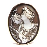 A LATE VICTORIAN SHELL CAMEO BROOCH the oval shell cameo with two female figures, possibly Night and