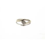 A 9 CARAT WHITE GOLD SINGLE STONE DIAMOND RING the illusion set brilliant cut of approximately 0.1