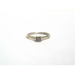 A 9 CARAT WHITE GOLD SINGLE STONE DIAMOND RING the illusion set brilliant cut of approximately 0.