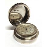 A SILVER CASED POCKET ANEROID BAROMETER & THERMOMETER BY J.C. VICKERY London, 1912, the silvered