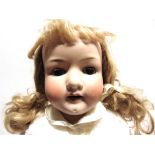 A HEUBACH OF KOPPELSDORF BISQUE SOCKET HEAD DOLL with a replacement blonde wig, sleeping blue
