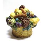 A LARGE PAINTED POTTERY GREENGROCER'S SHOP DISPLAY CENTREPIECE in the form of a basket of fruit