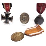 A SECOND WORLD WAR GERMAN THIRD REICH GROUP OF FOUR MEDALS comprising the Iron Cross Second Class;