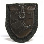 A GERMAN THIRD REICH CRIMEA CAMPAIGN SHIELD on its cloth backing.