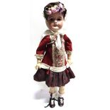 A FRENCH 'MON CHERI' BISQUE SOCKET HEAD DOLL lacking wig, with fixed brown paperweight glass eyes,