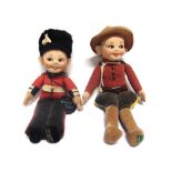 TWO NORAH WELLINGS CLOTH DOLLS the first a British guardsman, with painted facial features,