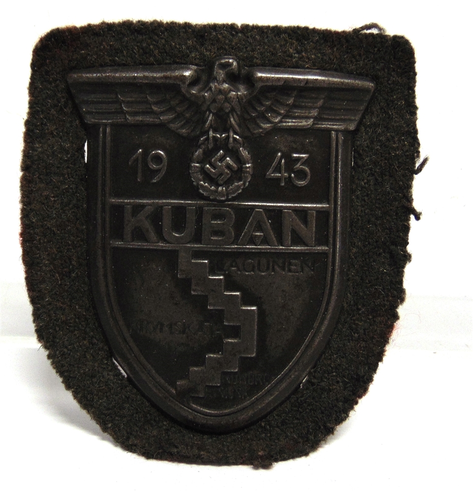 A GERMAN THIRD REICH KUBAN CAMPAIGN SHIELD on its cloth backing.