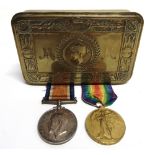 A GREAT WAR PRINCESS MARY CHRISTMAS 1914 BRASS GIFT TIN with a Great War pair of medals to