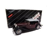 [WHITE METAL]. A 1/43 SCALE WESTERN MODELS NO.WMS43, 1936 SS I TOURER dark maroon with a black