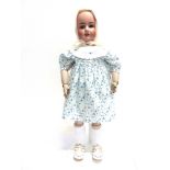 A FRENCH BISQUE SOCKET HEAD DOLL lacking wig, with sleeping blue-grey glass eyes, pierced ears and