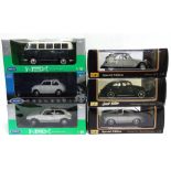 SIX 1/18 SCALE DIECAST MODEL CARS including Volkswagens, each mint or near mint and boxed.