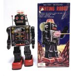 A HORIKAWA (JAPAN) TINPLATE FIGHTING ROBOT metallic dark grey with red feet, battery operated,