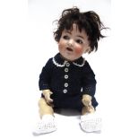 A SIMON & HALBIG BISQUE SOCKET HEAD CHARACTER DOLL with a cropped dark brown wig, sleeping blue-grey