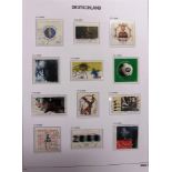 STAMPS - A GERMANY (WEST & RE-UNIFIED) COLLECTION in four Davo albums, each with slipcase.