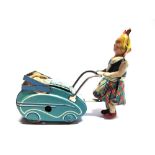 A GERMAN TINPLATE MODEL OF A GIRL PUSHING A PRAM marked 'Made in Germany / U.S. Zone' and 'Goso',