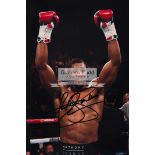Anthony Joshua signed photograph, 12 by 8in.