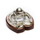 An Edwardian silver-plated novelty inkstand with a design incorporating a jockey cap and horse shoe,