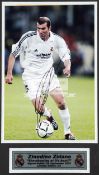 Zinedine Zidane signed photograph, a 12 by 8in.
