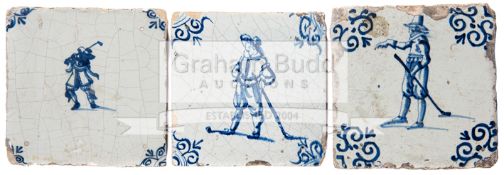 Three antique Dutch Delft blue & white wall tiles depicting the game of kolf, 13cm.